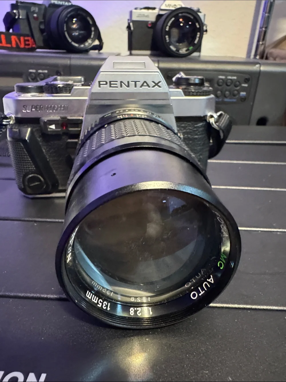 Pentax Silver and Black SLR with 135mm Telephoto Lens